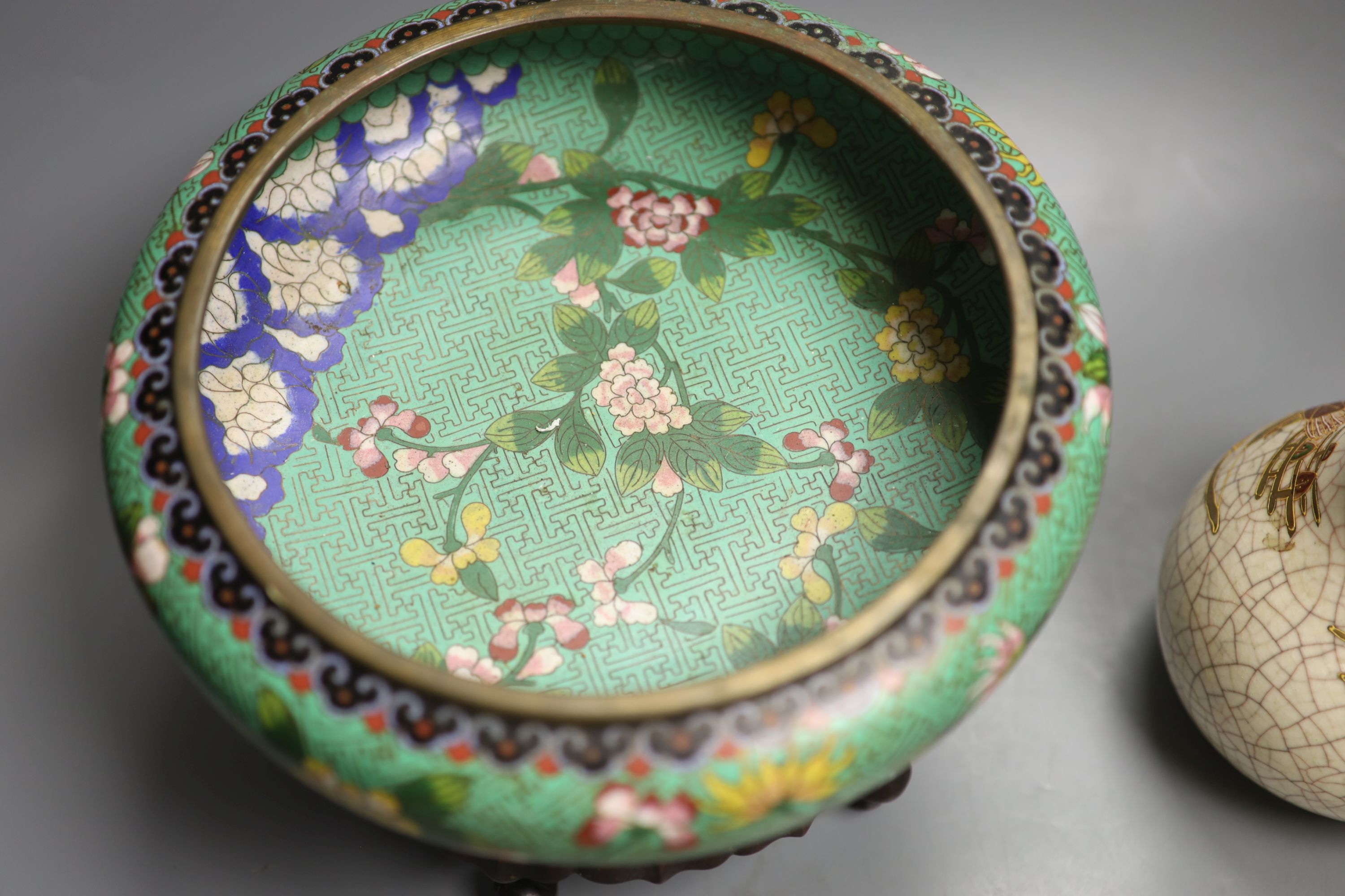 A Chinese cloisonne enamel bowl, wood stand, early 20th century and a Japanese vase